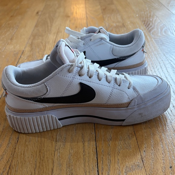 Nike White Low-Top Sneakers with Black Swoosh and Gold Accent - Picture 10 of 15